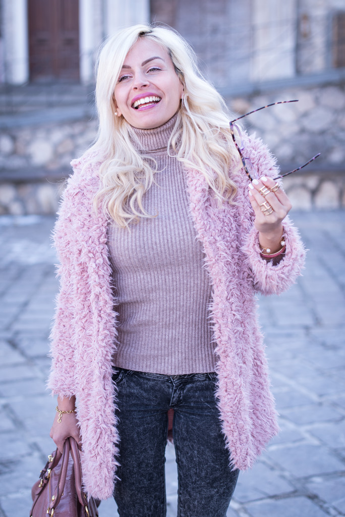 Happy in a pink faux fur coat